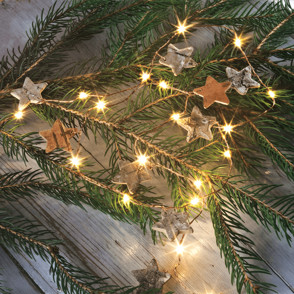 Dekorative LED - Lichterkette mit hübschen Holzsternen - Weihnachtsladenhellum